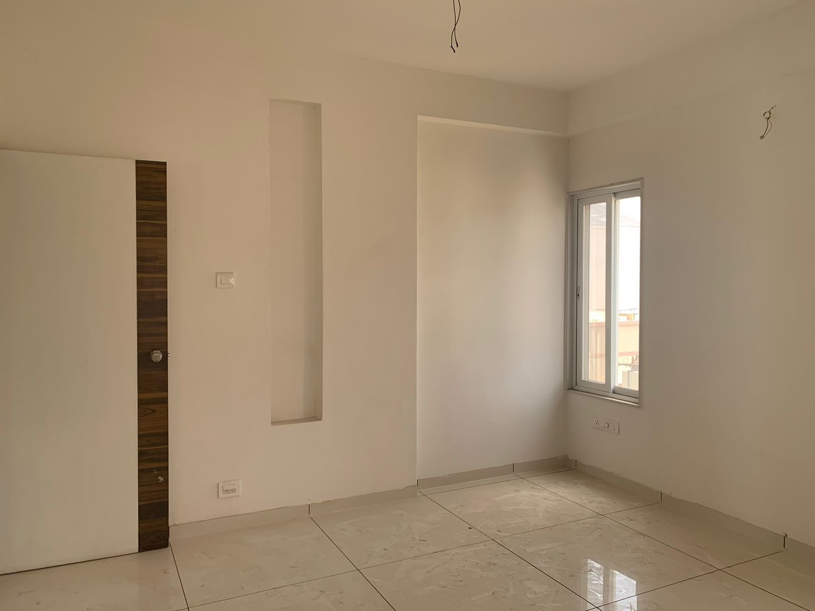 Bare shell bedroom before renovation